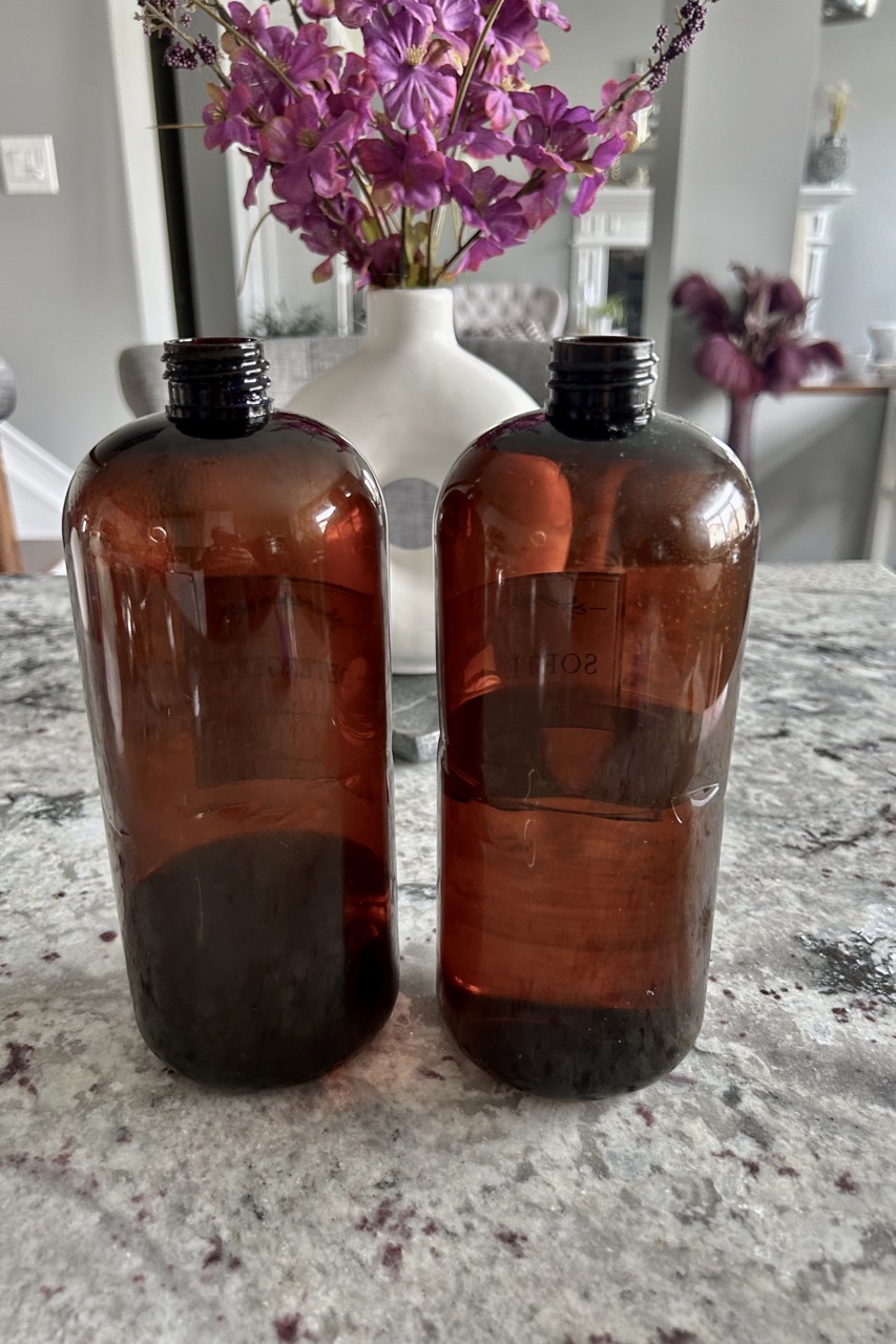 close up image of brown bottles with labels removed ready for diy