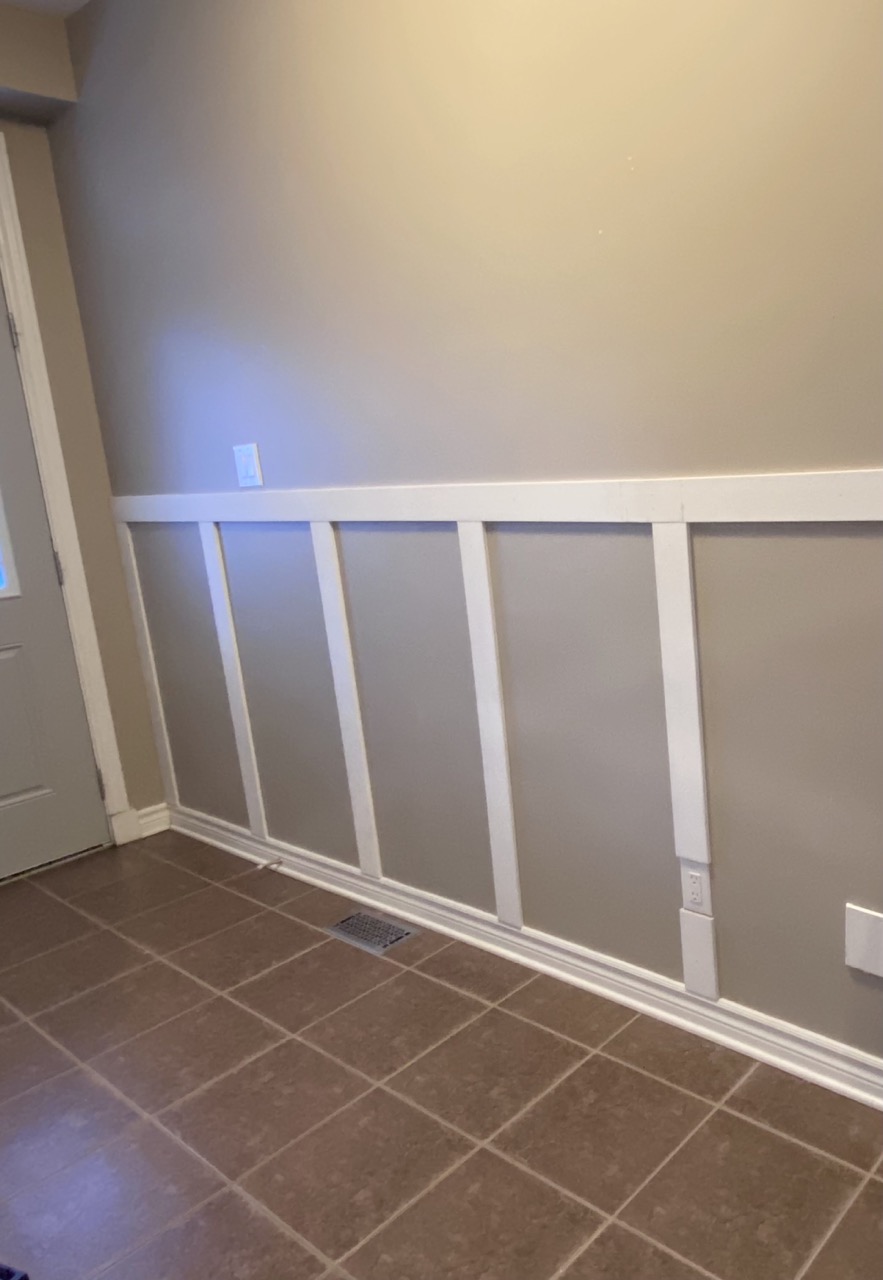 image of diy front entryway board and batten molding under construction