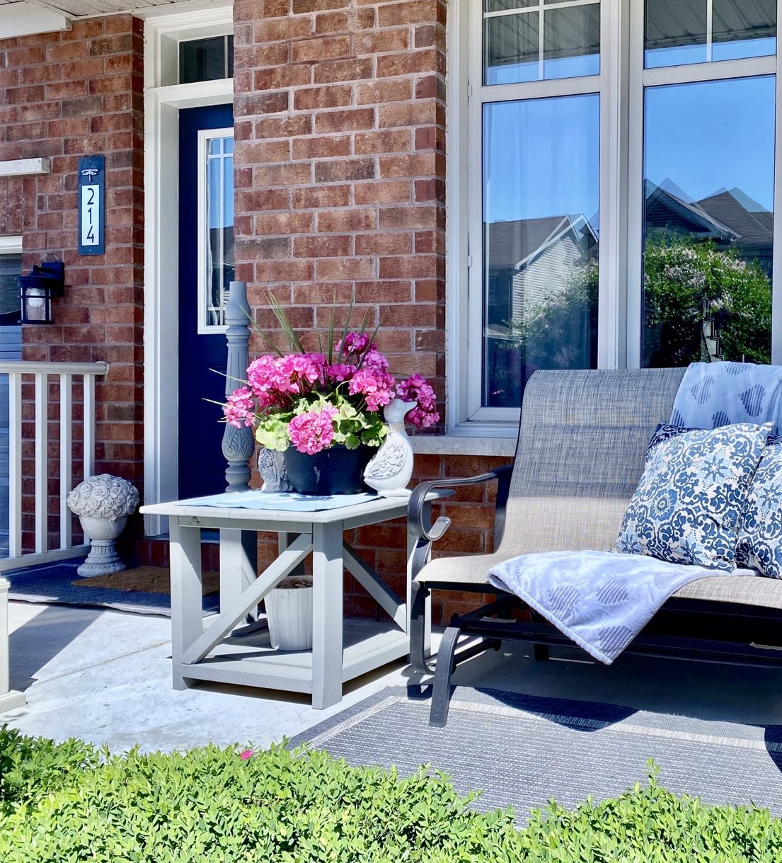 image of grey diy patio table with pink flowers