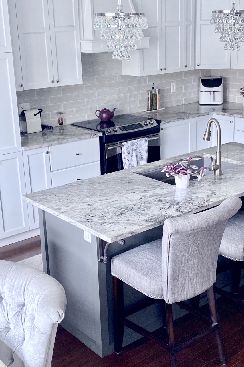 image of kitchen makeover ideas showing island updated in grey paint and a marble countertop