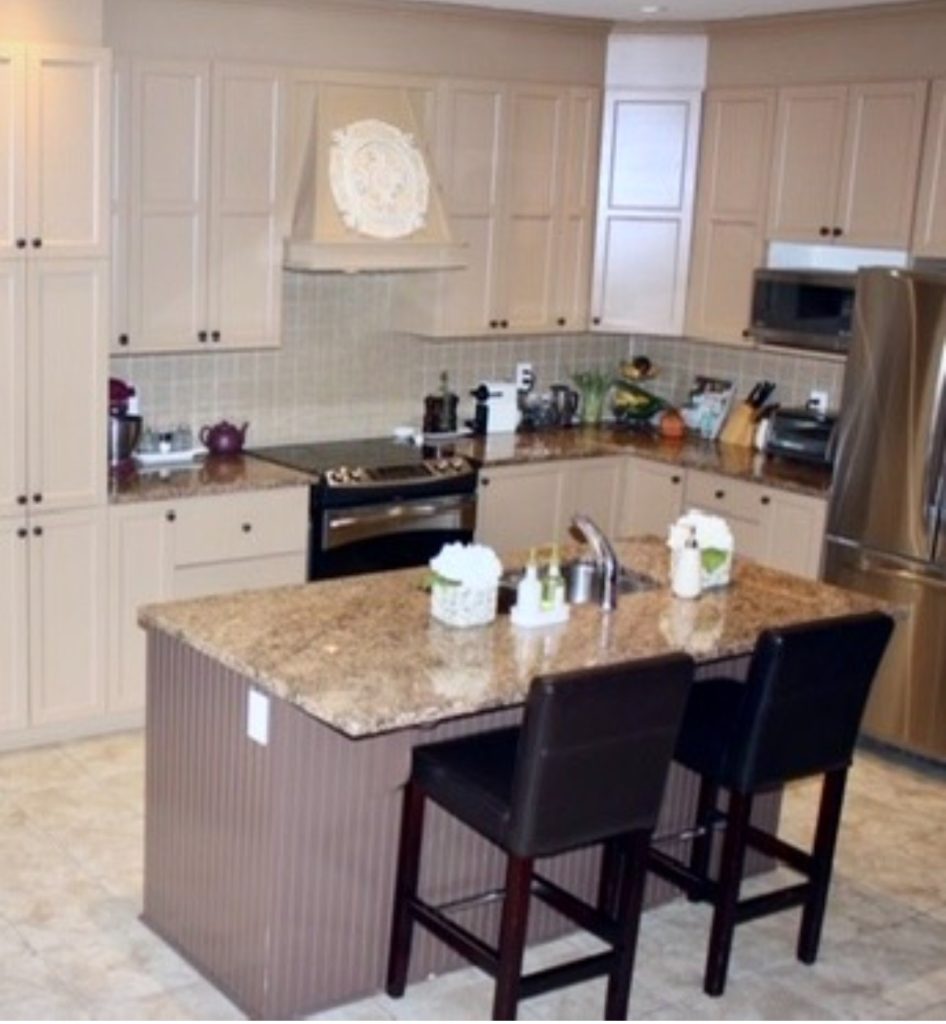 image of the kitchen before with the old caramel coloured cabinets