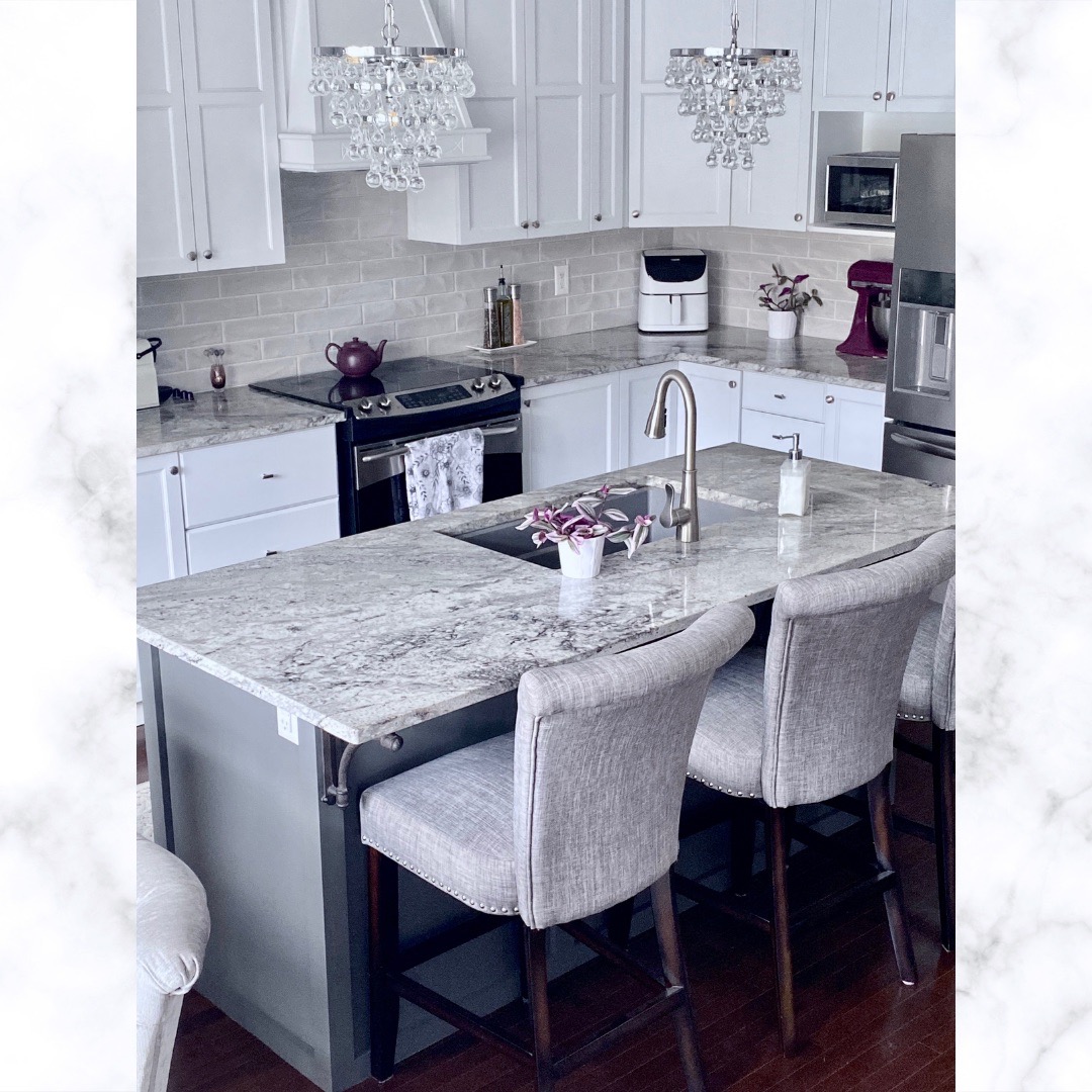 image of kitchen makeover ideas showing new white cupboards and grey island with marble countertop