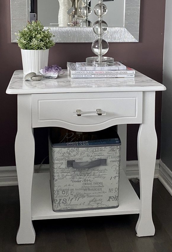 closeup of bedside table repainted in white
