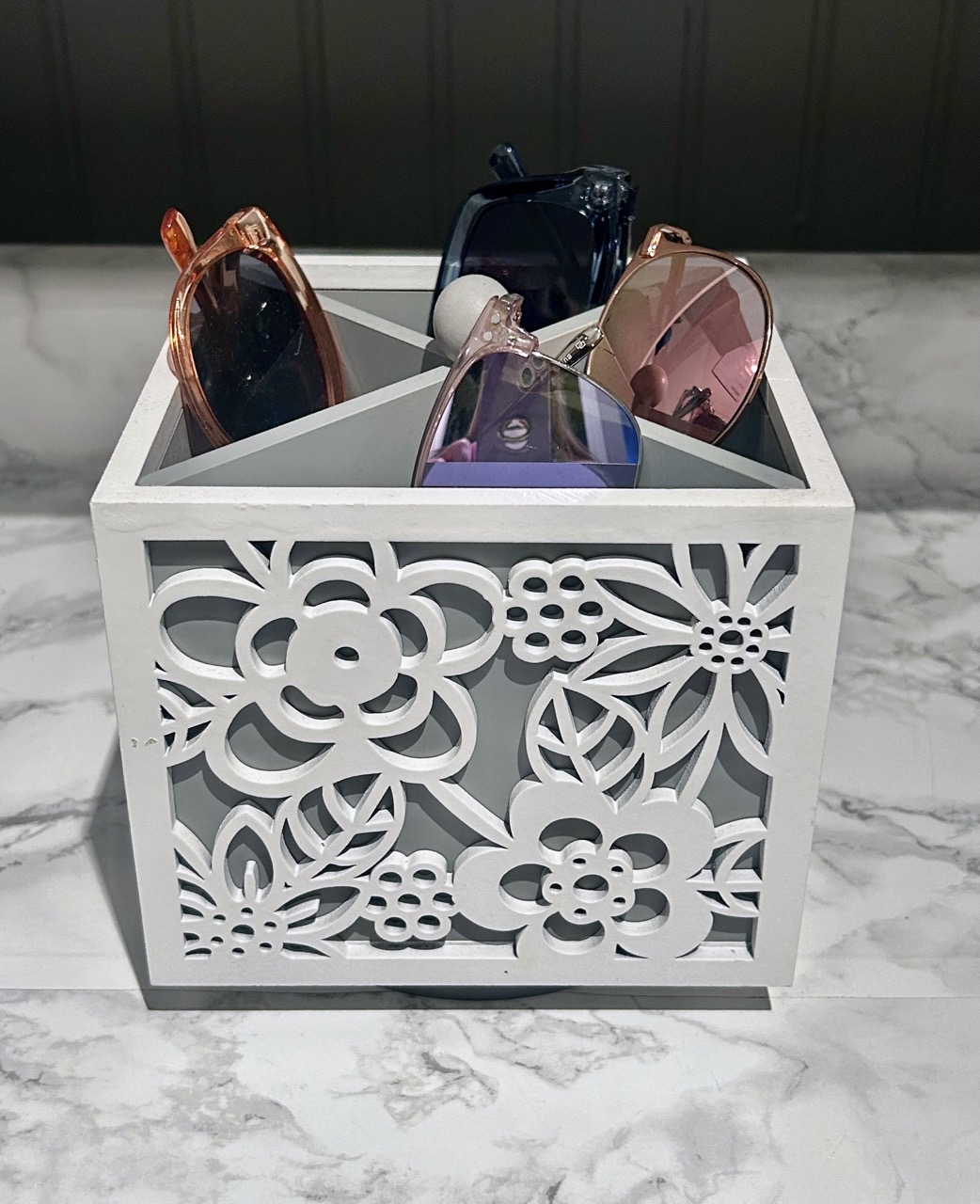 image of pen holder filled with sunglasses