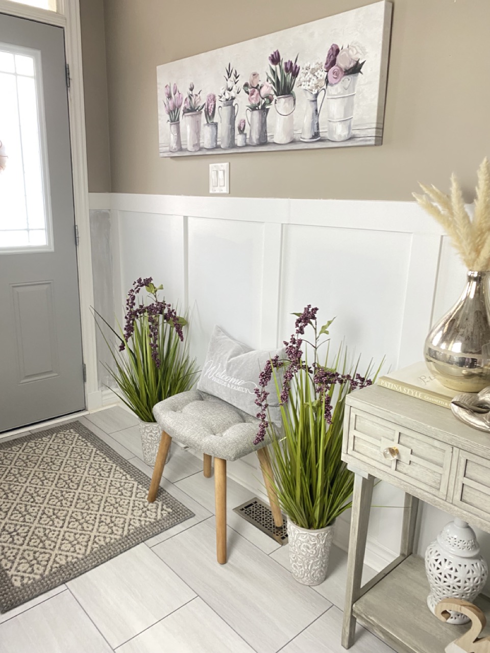 reveal image of front entryway makeover with new floor and board batten wall