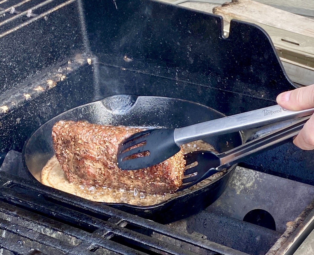 image of salmon getting turned over on bbq