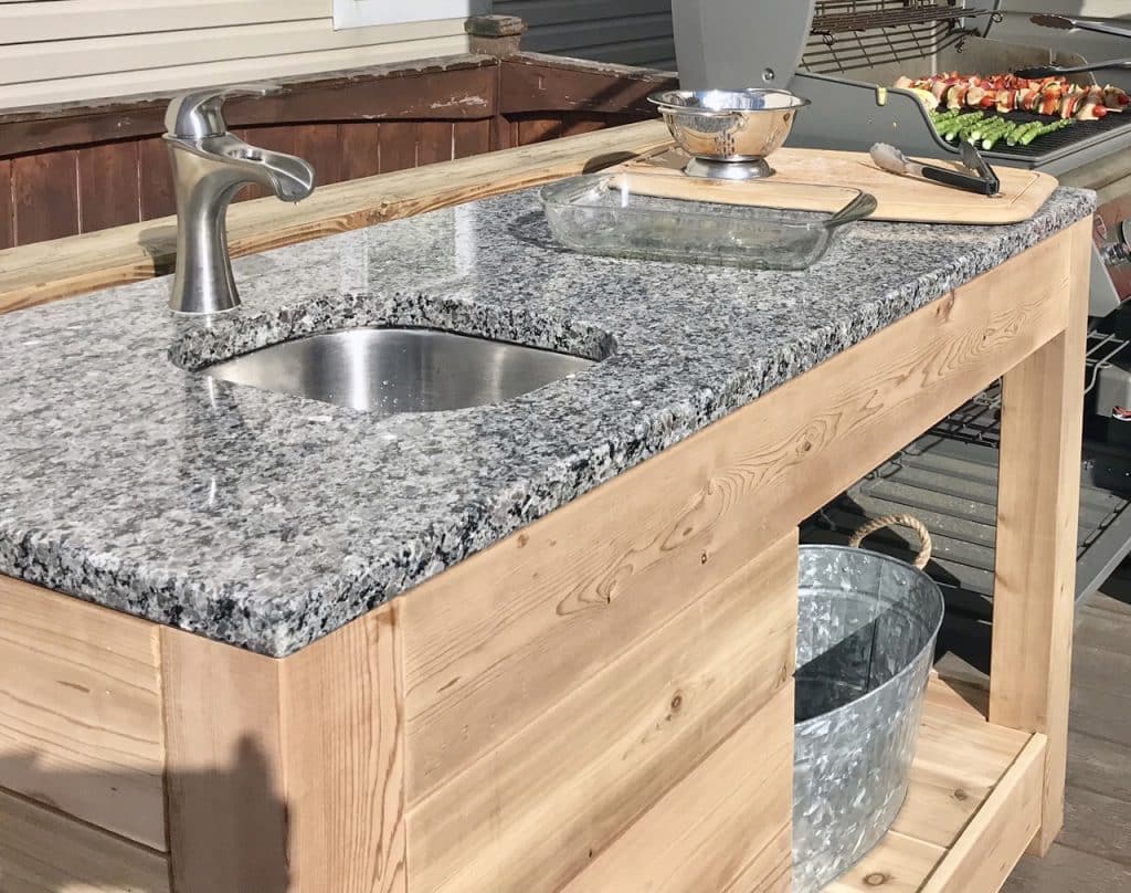 image of outdoor kitchen with food being prepped on top